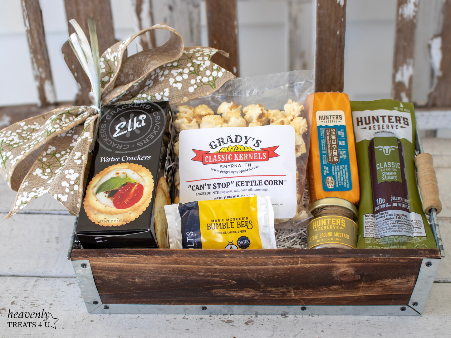 Gift basket with snacks and treats on a wooden surface